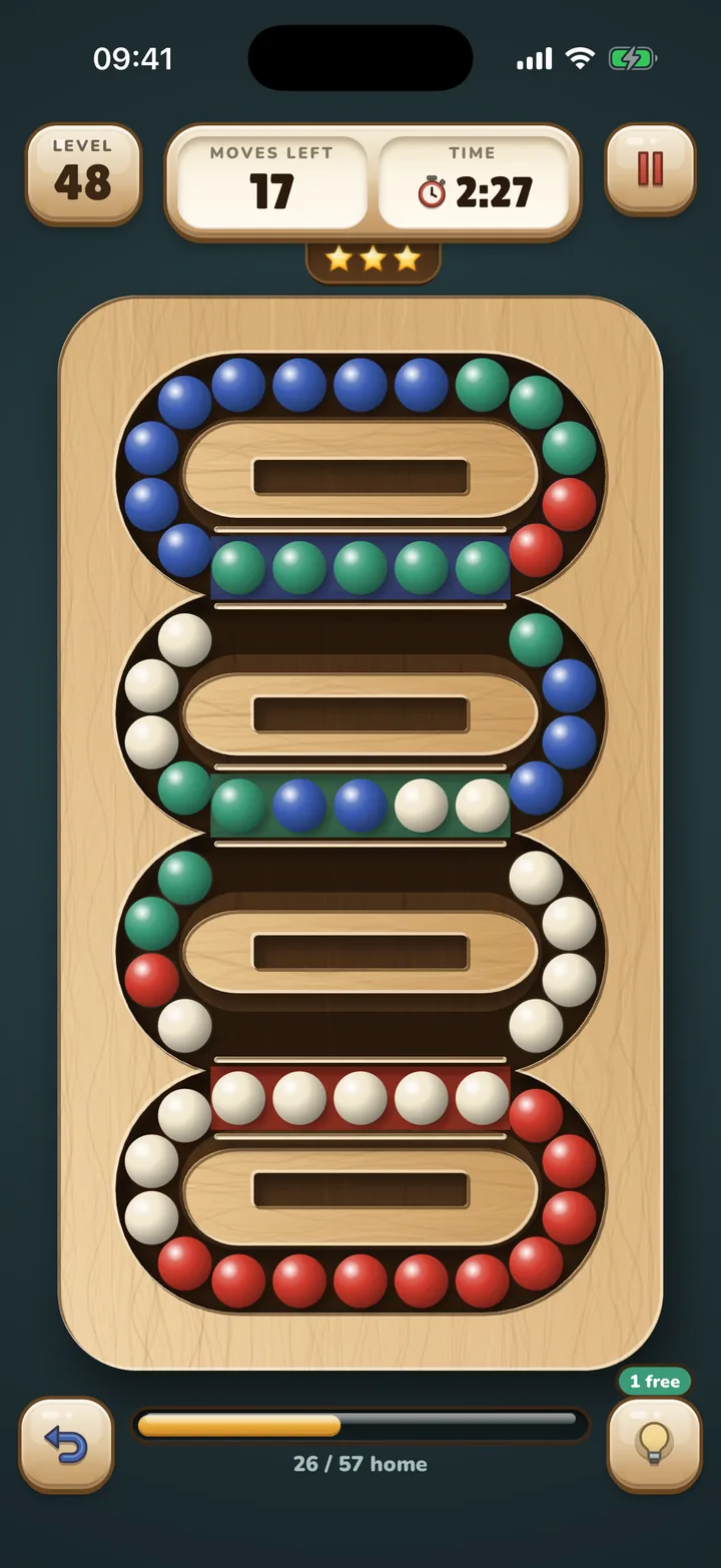 A Lollyloop board: loops of coloured lollies on a wooden tray
